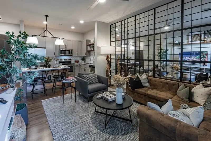 Open-concept living room and kitchen in a Fitzroy Grove model apartment